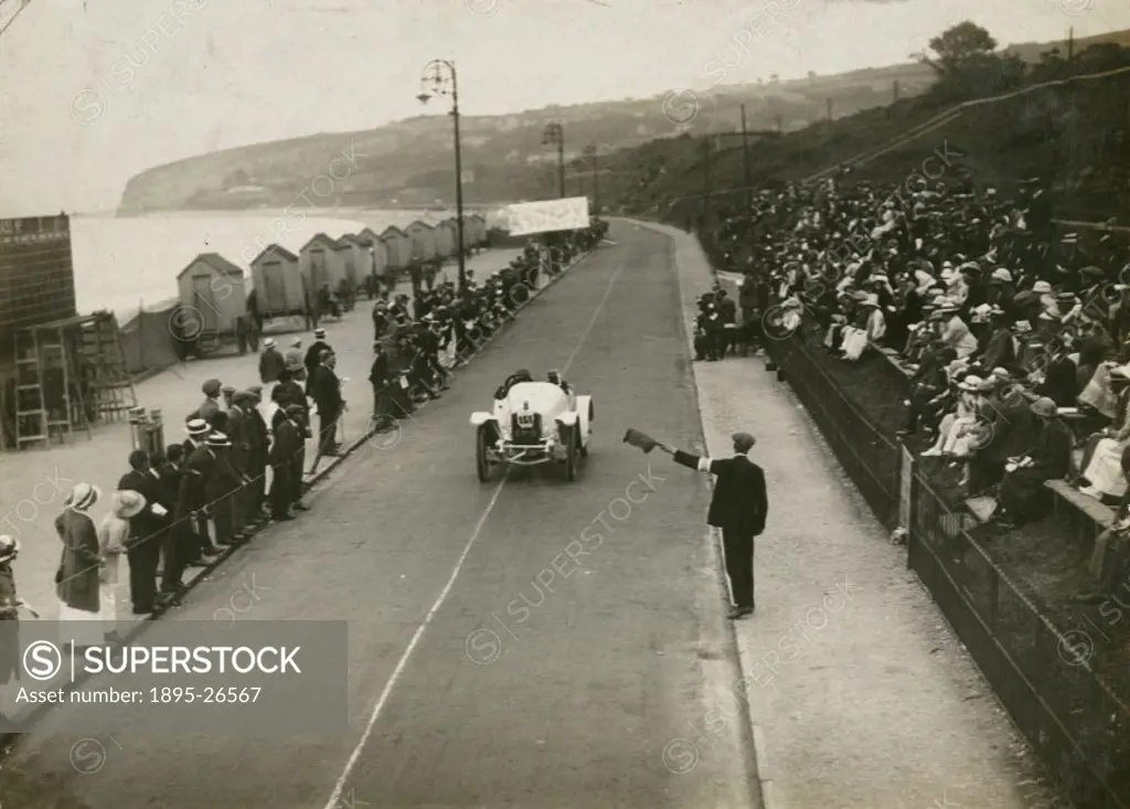 Photograph by H Wade. An official flags down the Sunbeam car driven by Eric Myers during a speed trial held on the promenade at Colwyn Bay, North Wale...