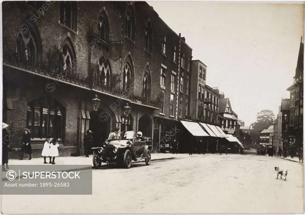 Photograph by H Wade showing a car parked on the street outside the Raven Hotel, Shrewsbury, Shropshire.