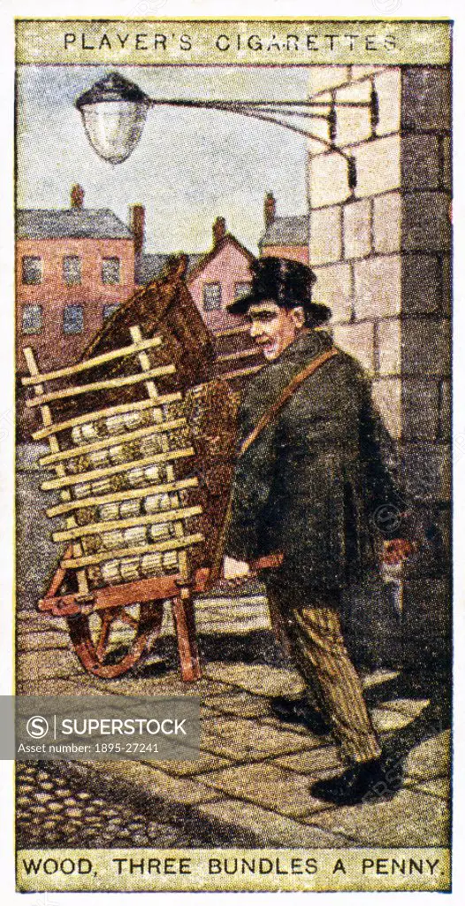 A street hawker in a top hat pushes a cart loaded with bundles of kindling wood for sale. Number 22 in the 1916 series Cries of London, 2nd Series’ b...