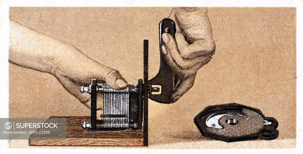 How to build a two valve set’, No 4, Godfrey Philips cigarette card, 1925. The reverse of the card reads: Fixing the Tuning Condenser. The variable ...