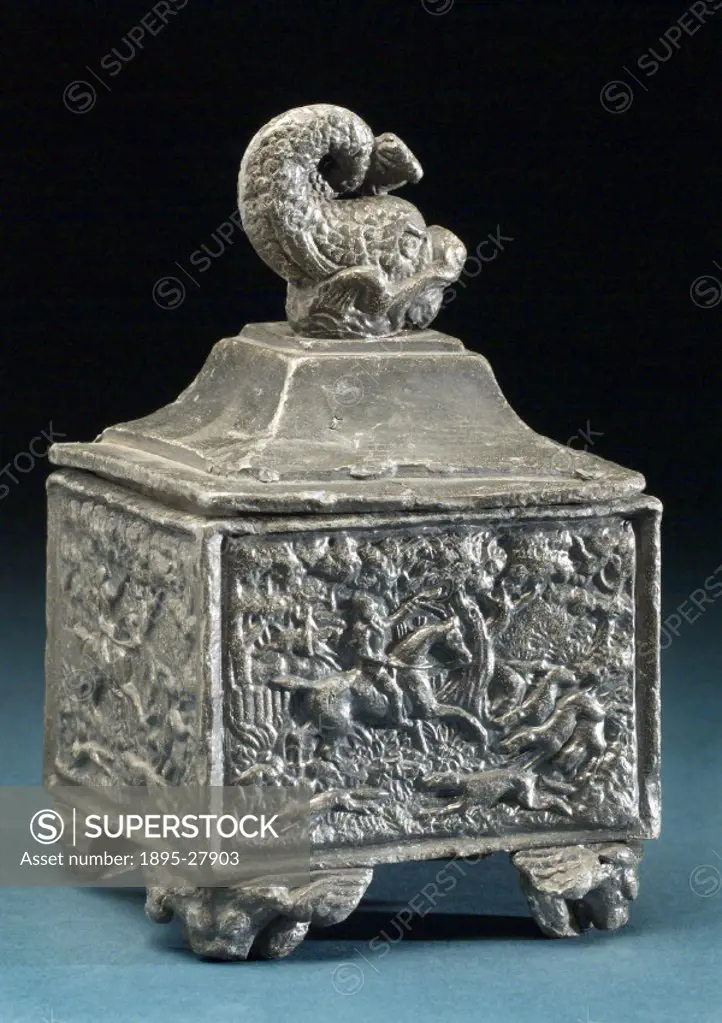 Square jar used for storing pipe tobacco with cambered lid surmounted by a dolphin shaped finial and hunting scenes on the jar panels. Containers for ...