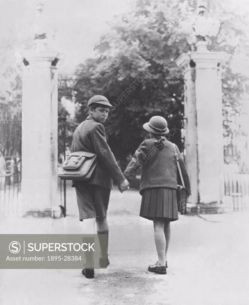 Two school children walking hand in hand, 26 August 1960.
