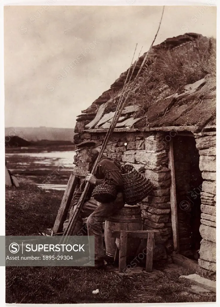 Photograph of an old man resting on a barrel outside a stone cottage, taken by Colonel Joseph Gale (c 1835-1906). The man takes a rest whilst he smoke...