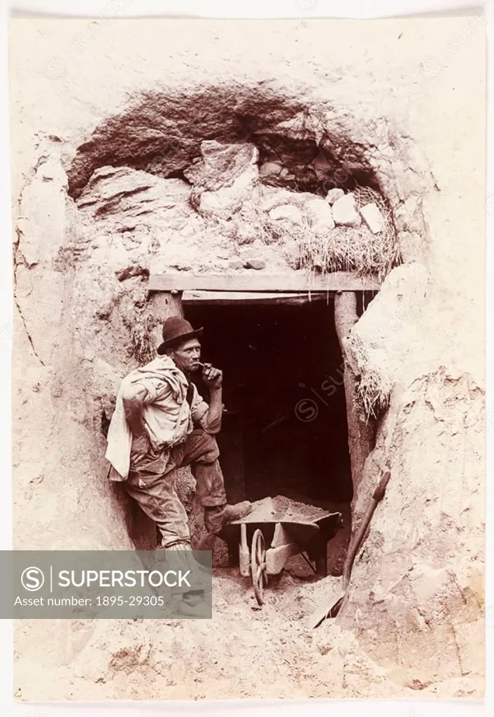 A photograph of a miner at the top of a mineshaft, taken by Colonel Joseph Gale (c 1835-1906) in about 1890.  The man stands at the top of the shaft, ...