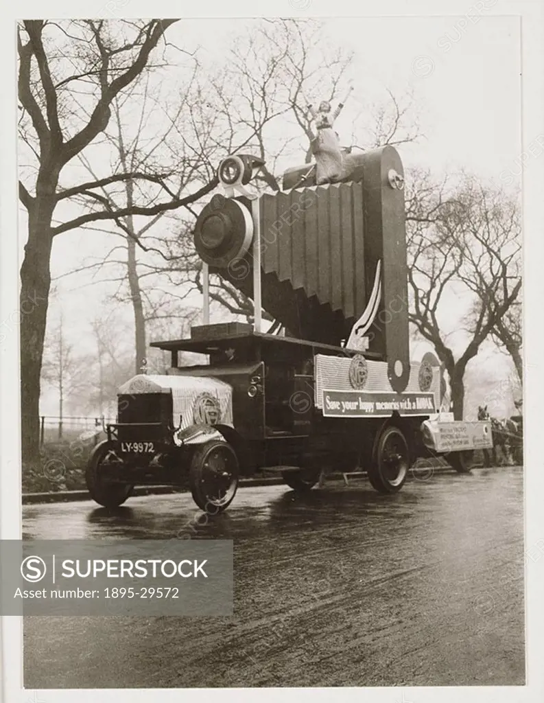 A snapshot photograph of a Kodak advertising float, taken by an unknown photographer in 1912  Probably made for a carnival parade, this float has a ´K...