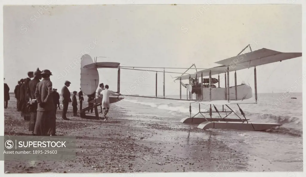 A snapshot photograph of an early seaplane on a beach, taken by an unknown photographer in about 1913.  Originally a shooting term, ´snapshot´ began t...