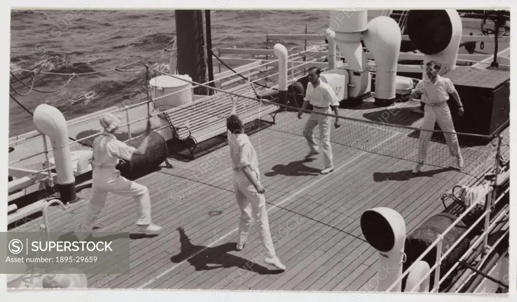 A snapshot photograph of four men playing a game of badminton on the deck of a ship, taken by an unknown photographer in about 1935.  Originally a sho...