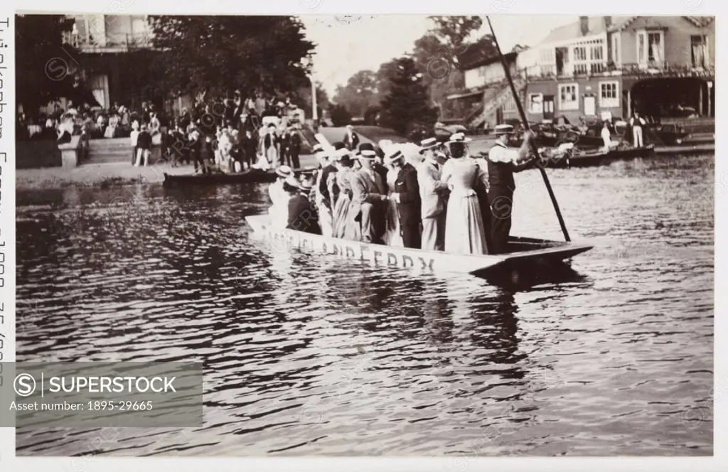 A snapshot photograph of a small ferry boat carrying passengers across the River Thames at Twickenham, Surrey, taken by an unknown photographer in abo...