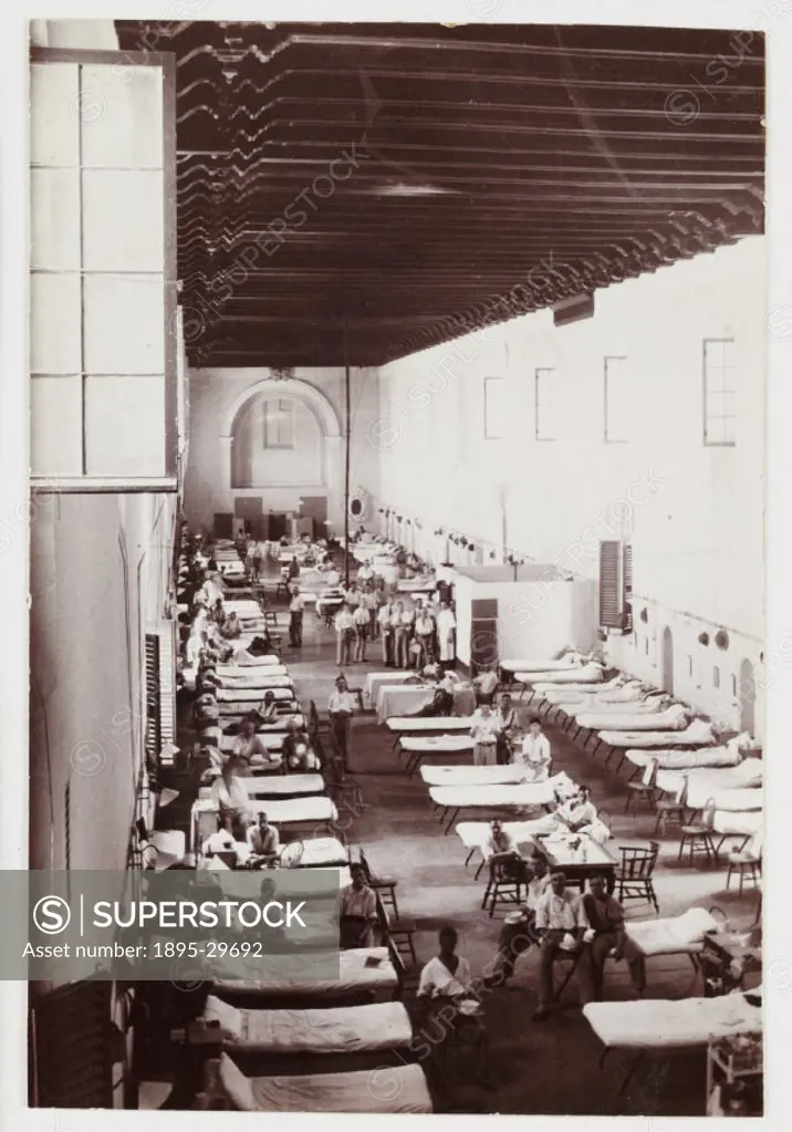 Snapshot photograph of the interior of a military hospital, taken by an unknown photographer in about 1916. Originally a shooting term, the word ´snap...