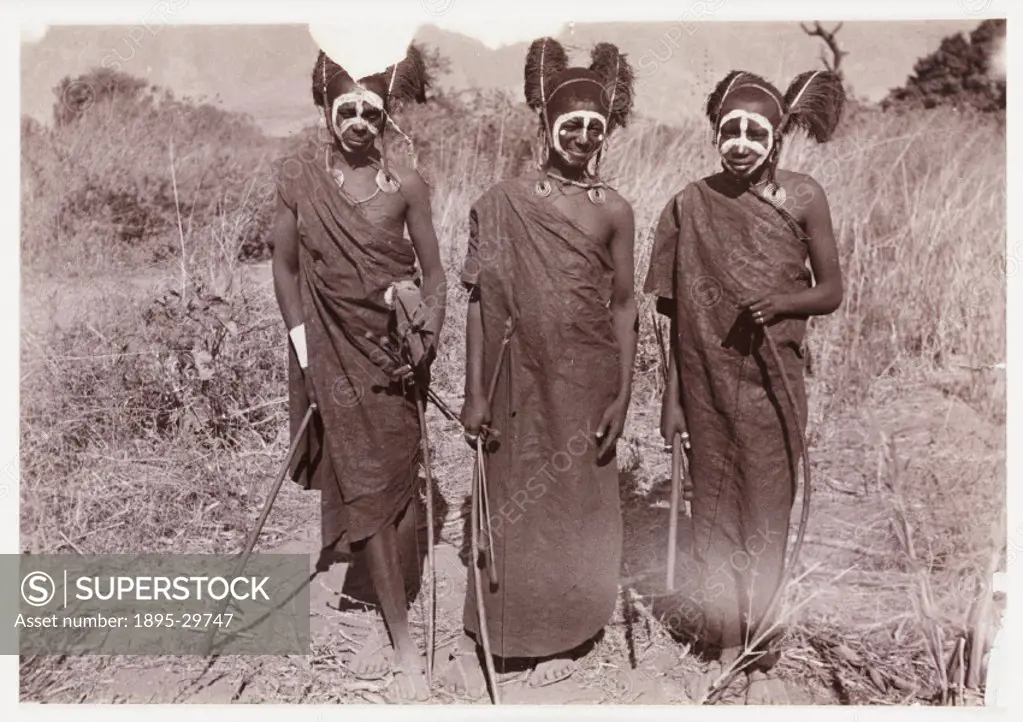 A snapshot photograph of three African tribesmen, taken by an unknown photographer in about 1905.  These three young men are posing self-conciously in...