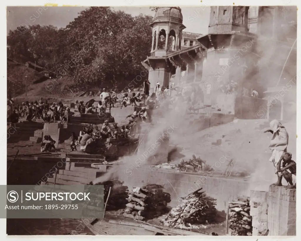 A snapshot photograph of funeral pyres on the banks of the River Ganges, India, taken by an unknown photographer in about 1910.  Benares, now called V...