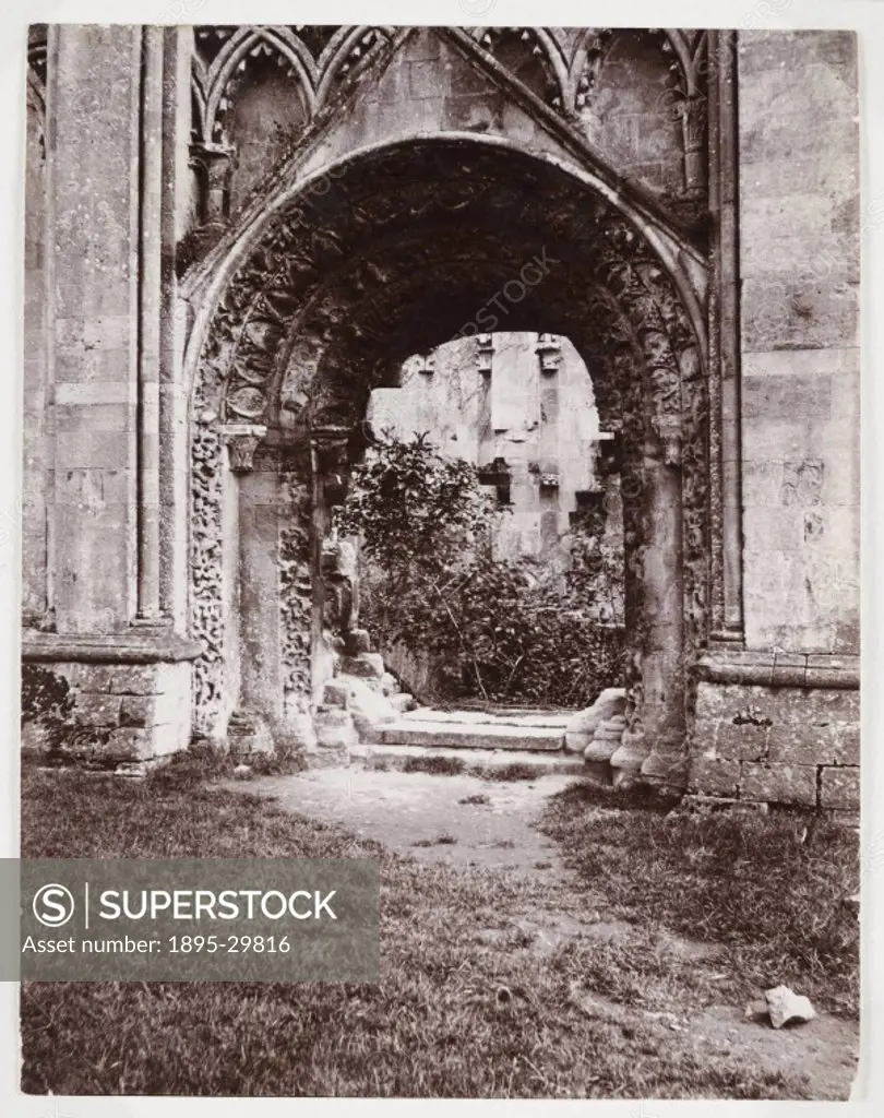 A snapshot photograph of an overgrown doorway in a ruined abbey, taken by an unknown photographer in about 1900.  A picturesque photograph, perhaps ta...