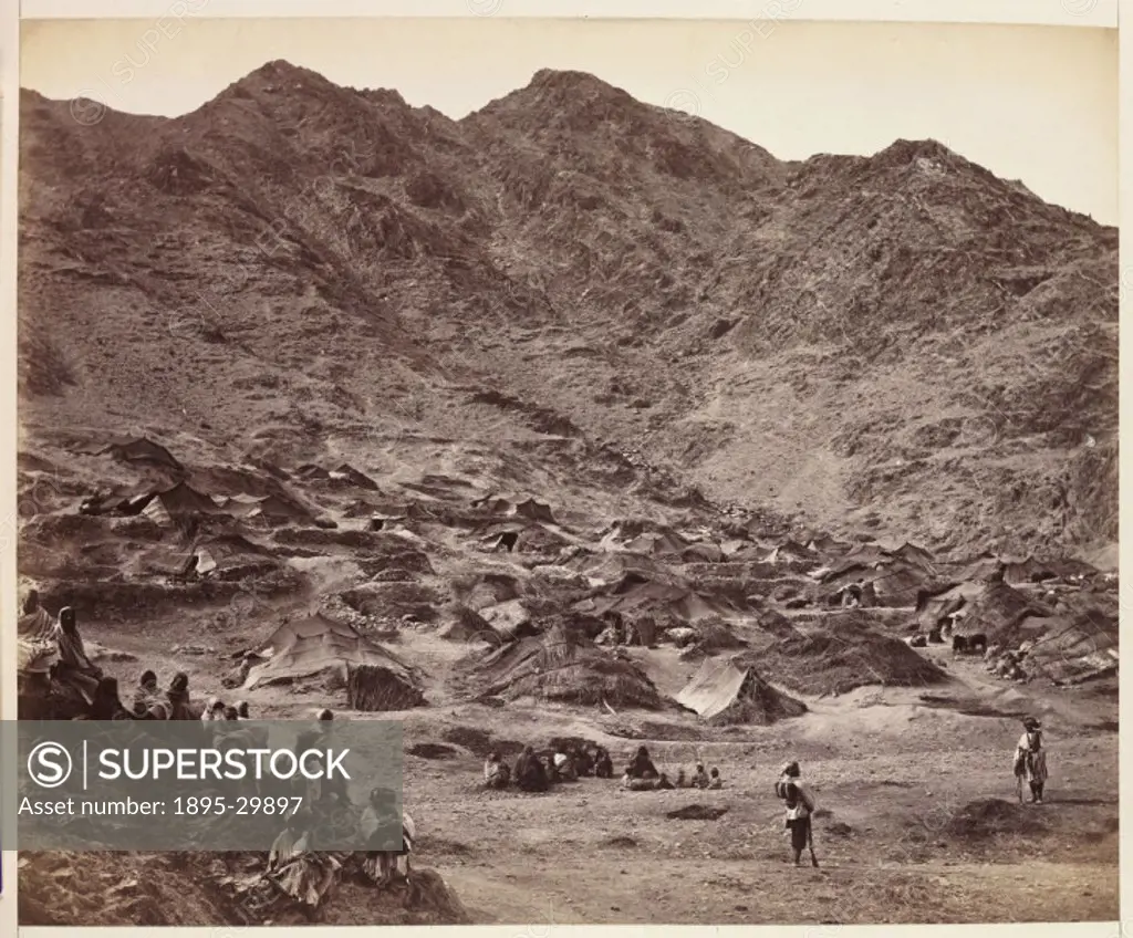 A photograph by John Burke 1845-1900 of the small village of Kutchi, near Dakka, Afghanistan, taken about 1878 and published in the album ´The Afgha...