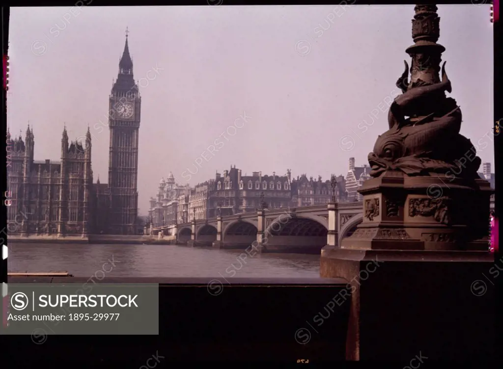 A Kodachrome colour photograph of the Houses of Parliament, seen from across the River Thames, London, taken by an unknown photographer in about 1945....