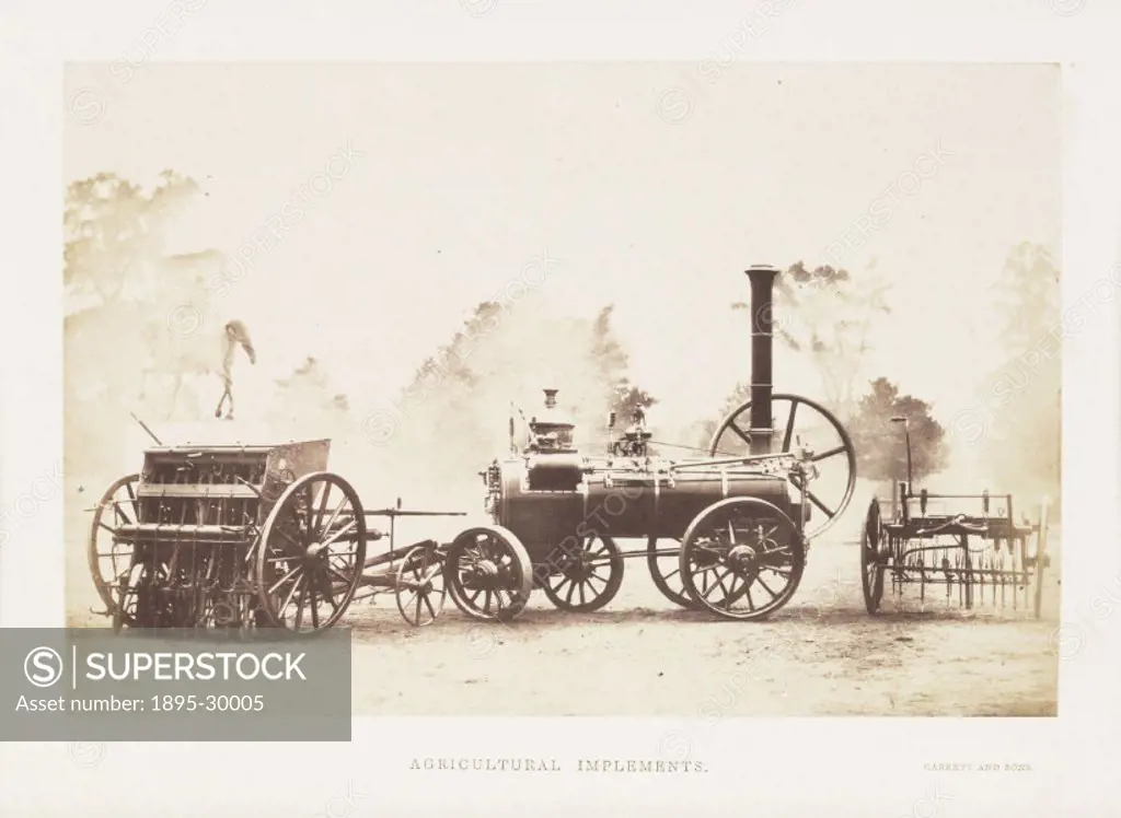 A photograph of various agricultural implements, including a steam traction engine and two types of seed drill, manufactured by Garrett and Sons and s...