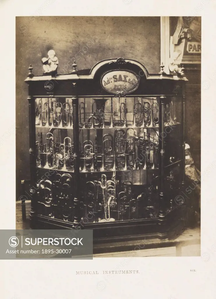 A photograph of a display case containing musical instuments,  manufactured by Adolphe Sax & Co. and shown at the Great Exhibition, taken by Claude-Ma...