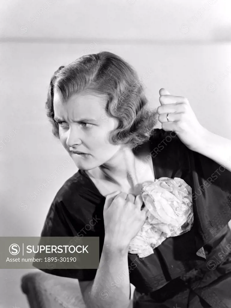 A photograph of a woman with a worried expression, taken by Photographic Advertising Limited in about 1955.  Some photographs by Photographic Advertis...
