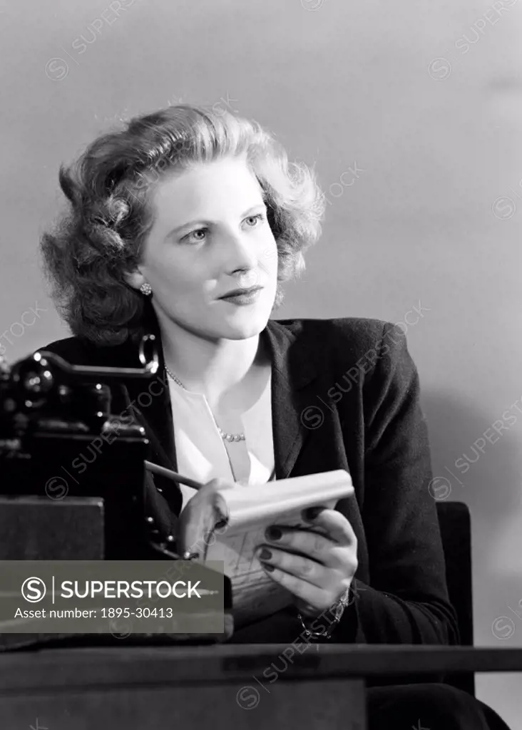 A photograph of a typist taking notes, taken by Photographic Advertising Limited in 1950.  Photographic Advertising Limited was founded in 1926 by a g...