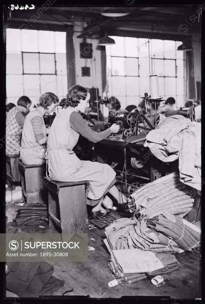 A photograph of sewing machinists at work, taken by James Jarche (1891-1965) for the Daily Herald newspaper on 24 November, 1933.  These women sewing ...