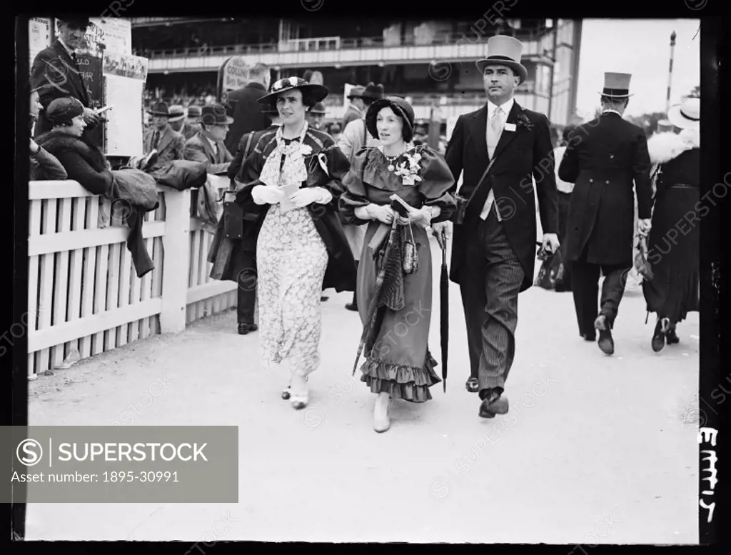 A photograph of racegoers at the second day of Royal Ascot for the Royal Hunt Cup horse-race, taken by Edward Malindine for the Daily Herald newspaper...