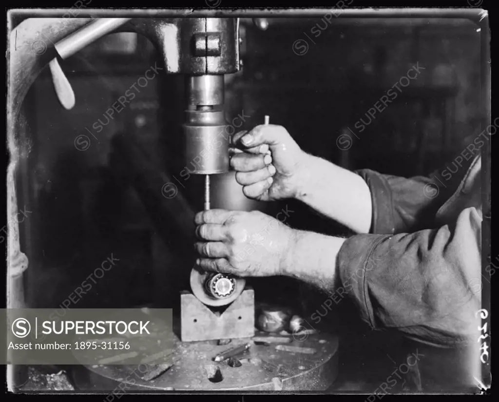 A photograph of a man operating a drill, taken by an unknown photographer for the Daily Herald newspaper in about 1938.  This photograph has been sele...