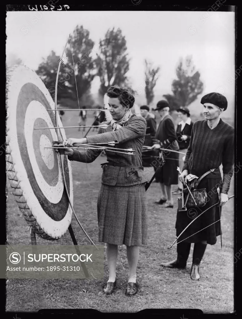 A photograph of competitors at an archery tournament held at Winchester, Hampshire, taken by Greaves for the Daily Herald newspaper on 5 September, 19...