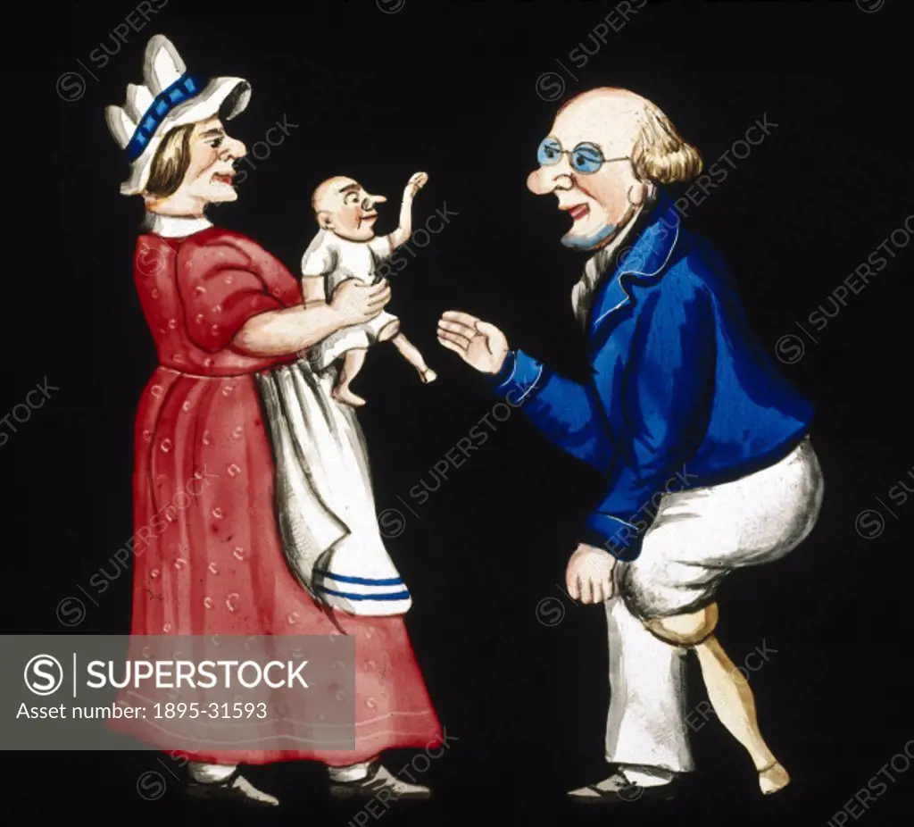 Couple with a baby, mid 19th century.Magic lantern slide of an elderly couple with a baby. The woman is holding the baby, while the man, who has a woo...