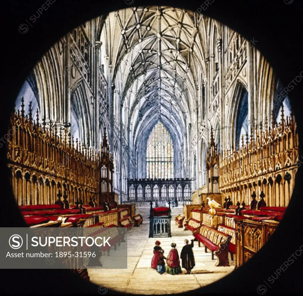 Choir stalls in a cathedral, mid 19th century.Magic lantern slide of the interior of a cathedral. Three people are walking past the empty choir stalls...