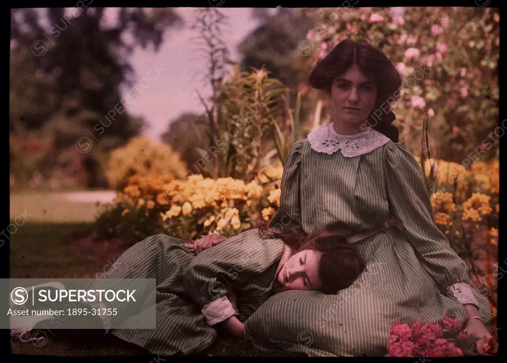 An autochrome of two sisters, daughters of the photographer, together in a garden on a hot summers day, taken by Etheldreda Janet Laing. The younger ...