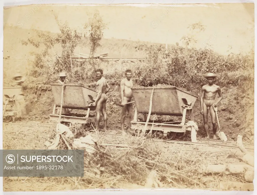 A photograph of native workers employed in the construction of the Panama Canal, taken by an unknown photographer. This photograph is from an album do...