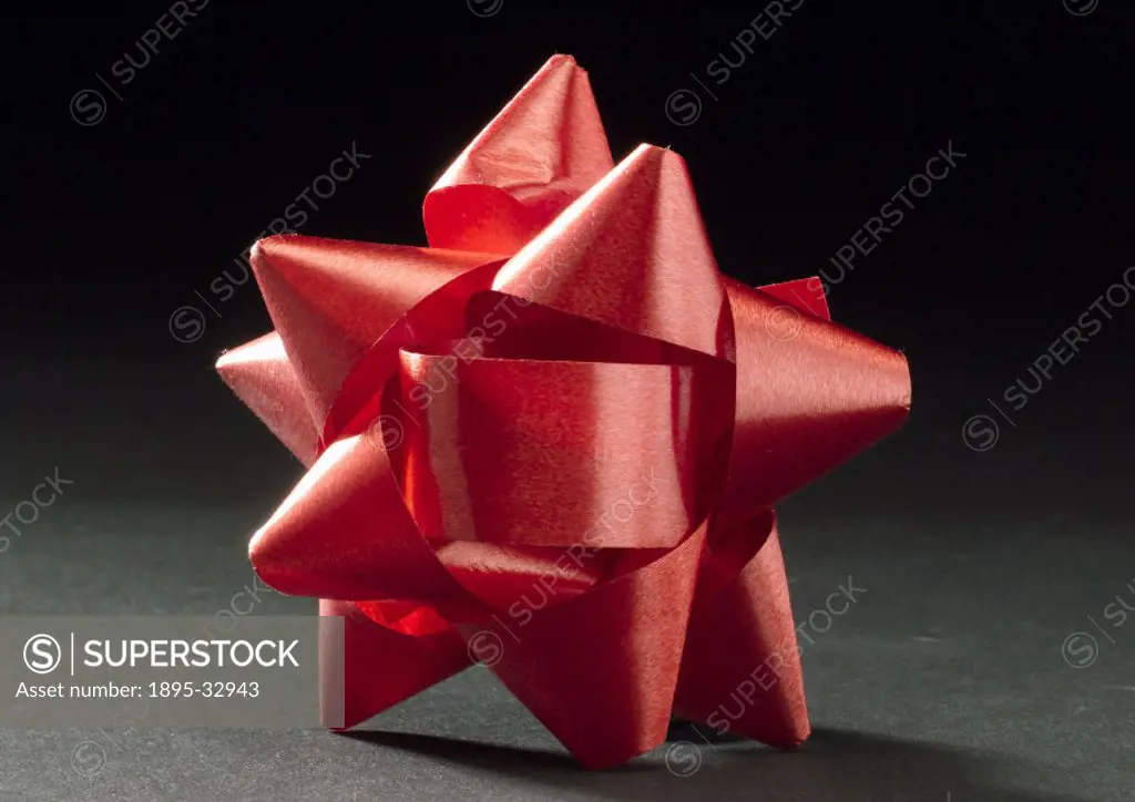 Red decorative bow made of expanded and orientated polypropylene.