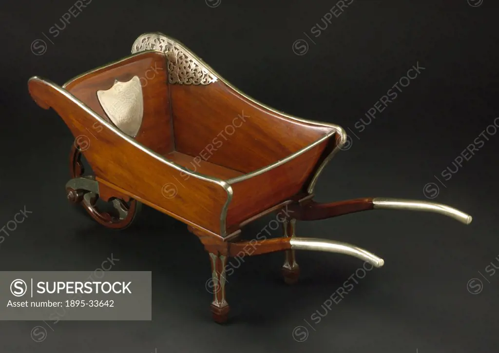 Wooden barrow with silver decorations, commemorating cutting the first sod of the West Lancashire Railway which was to run between Southport and Prest...
