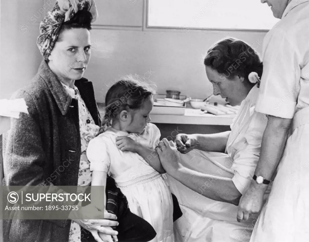 ´Linda Smith, aged three and a half, is just a little frightened of the needle as Doctor Joyce Williams gives her a diphtheria immunisation inside the...