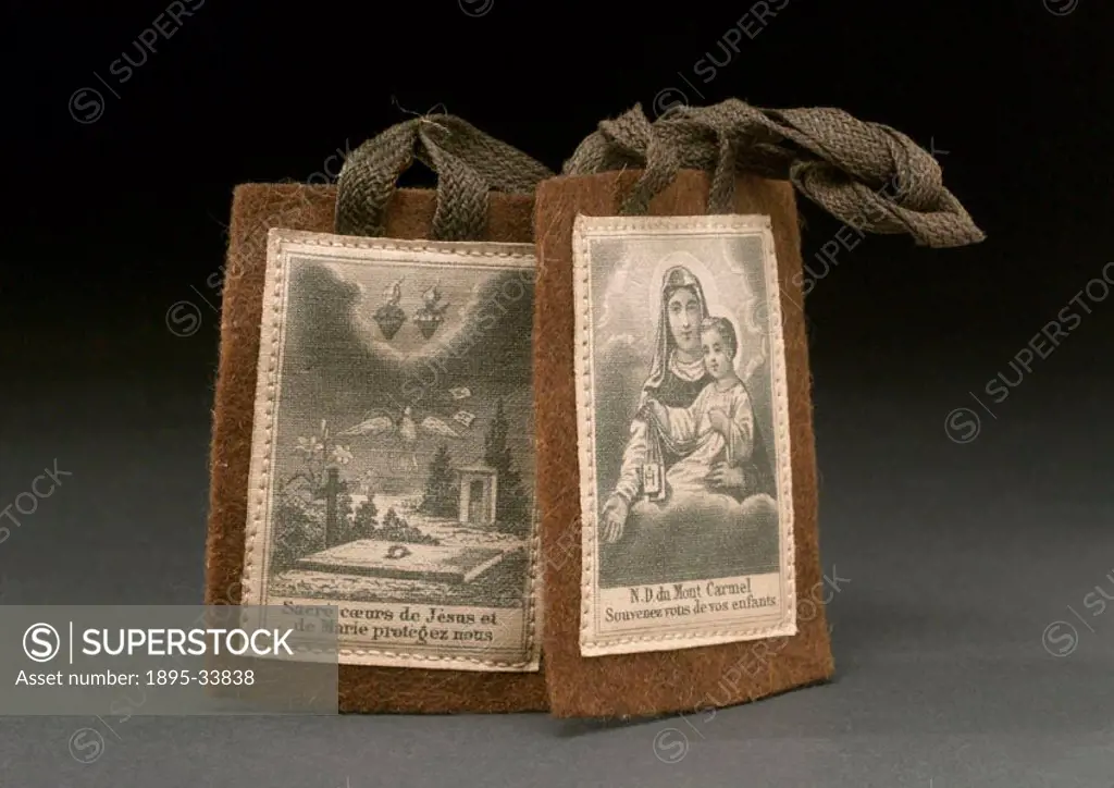 Brown flannel scapular with holy pictures and inscription in French, worn in the belief that it would protect children. Beneath an image of a grave an...