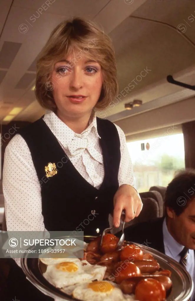 Pullman stewardess with breakfast platter, c 1980s.