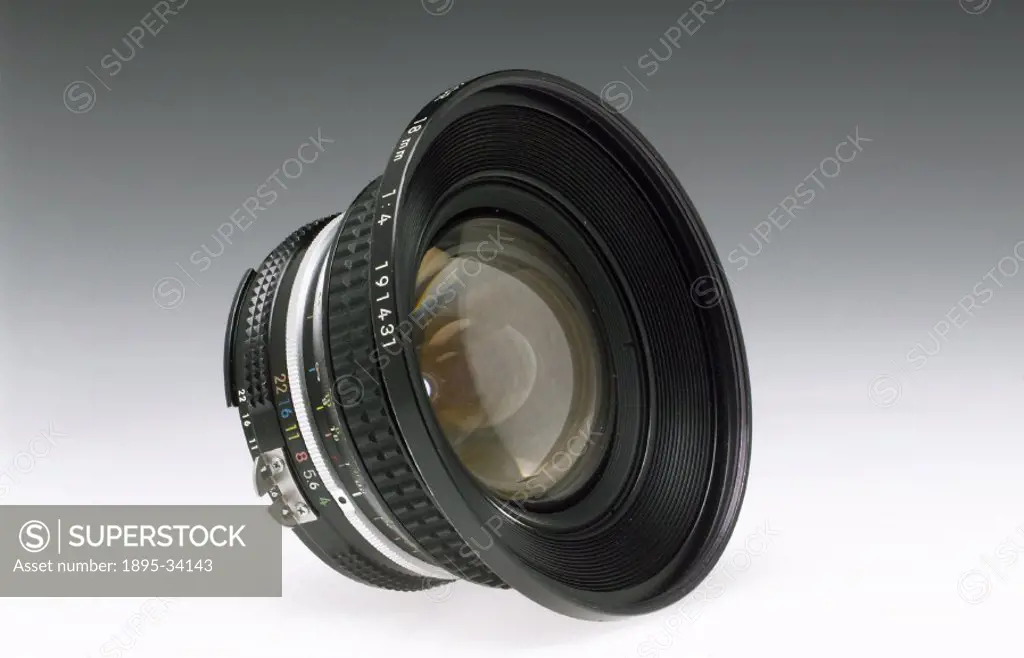 Nikkor 17mm F4 bayonet fitting wide angle lens for 35mm camera, c  1980s.