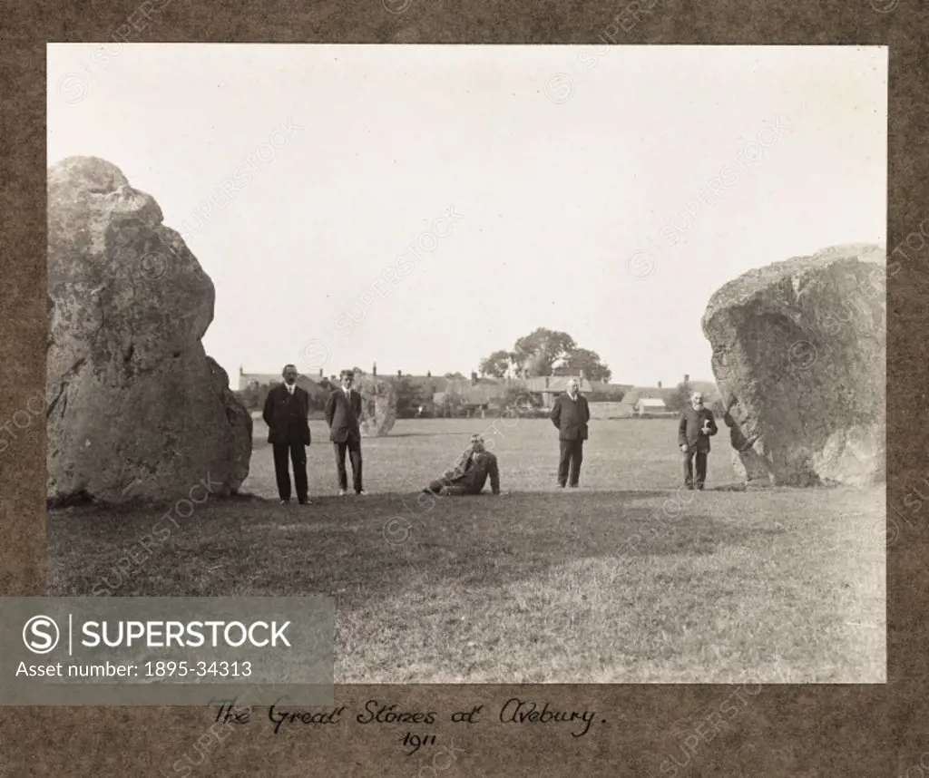 A photograph of a group of men admiring the Great Stones at Avebury, Wiltshire, taken by Sir John Benjamin Stone (1838-1914), in 1911.  The stone circ...