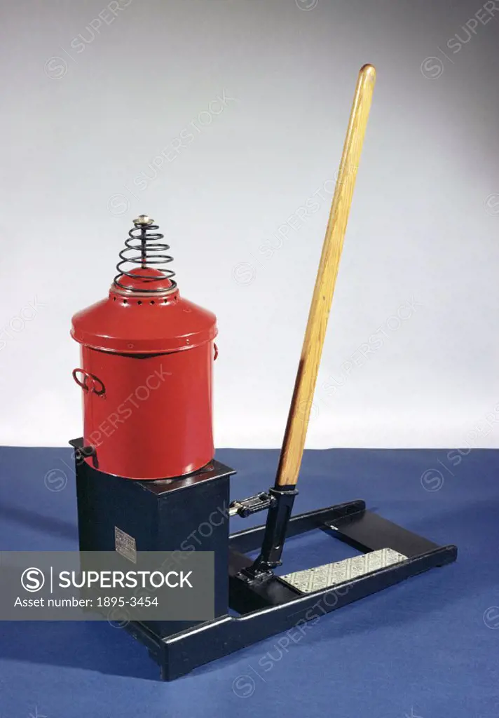 Two people would operate this mechanical vacuum cleaner. One person would guide the hose while the other would operate the suction pump by working the...