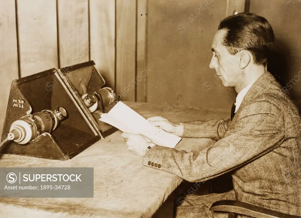 A photograph of Dr Josef Goebbels (1897-1945) making a radio broadcast, taken by an unknown photographer on January, 1936.  The German Minister of Pro...