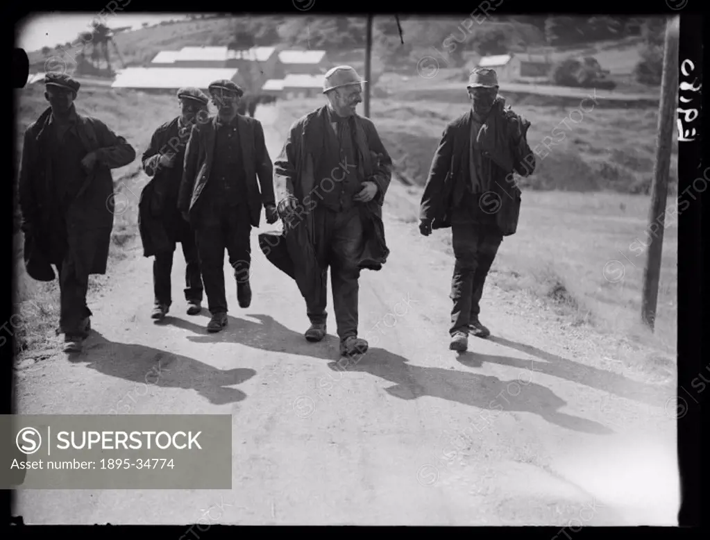 A photograph of miners returning to their homes in Bedwas, Wales following successful strike action, taken by Edward Malindine for the Daily Herald ne...