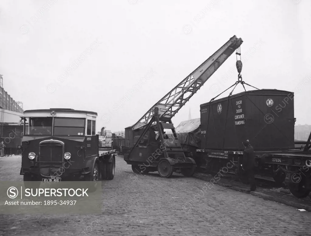 Containers being loaded onto a lorry at Paddington station, 8 November 1938.   Containers like this were often used to carry perishable foods such as ...