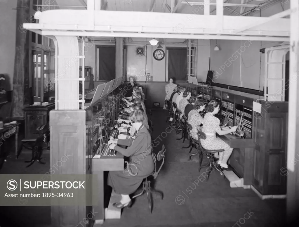 Female workers at the telephone exchange at Paddington station. It was common for women to be employed as typists or telephonists at this time but dur...