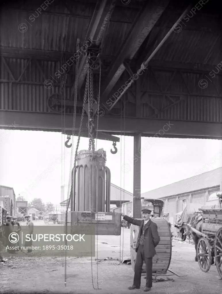 A gantry crane at a Great Western Railway goods yard, about 1917. This crane was used for moving freight on and off wagons in railway goods yards.   T...