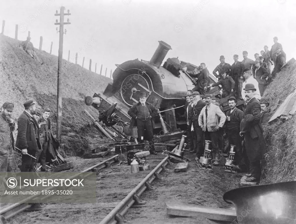 A derailed locomotive at Marazion in Cornwall, November 1894.   The accident was caused by flooding. Water got onto the line and although it had large...