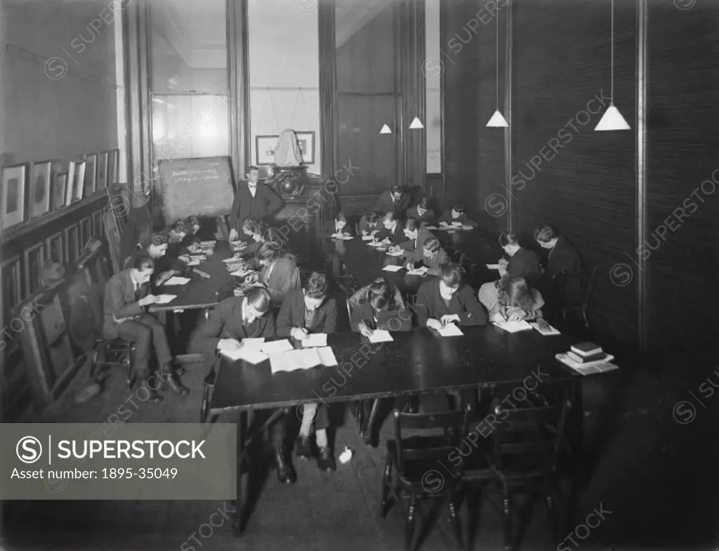 A mathematics class at Paddington station, 1921.   Railway workers were given training in many subjects, including safety issues, how locomotives work...