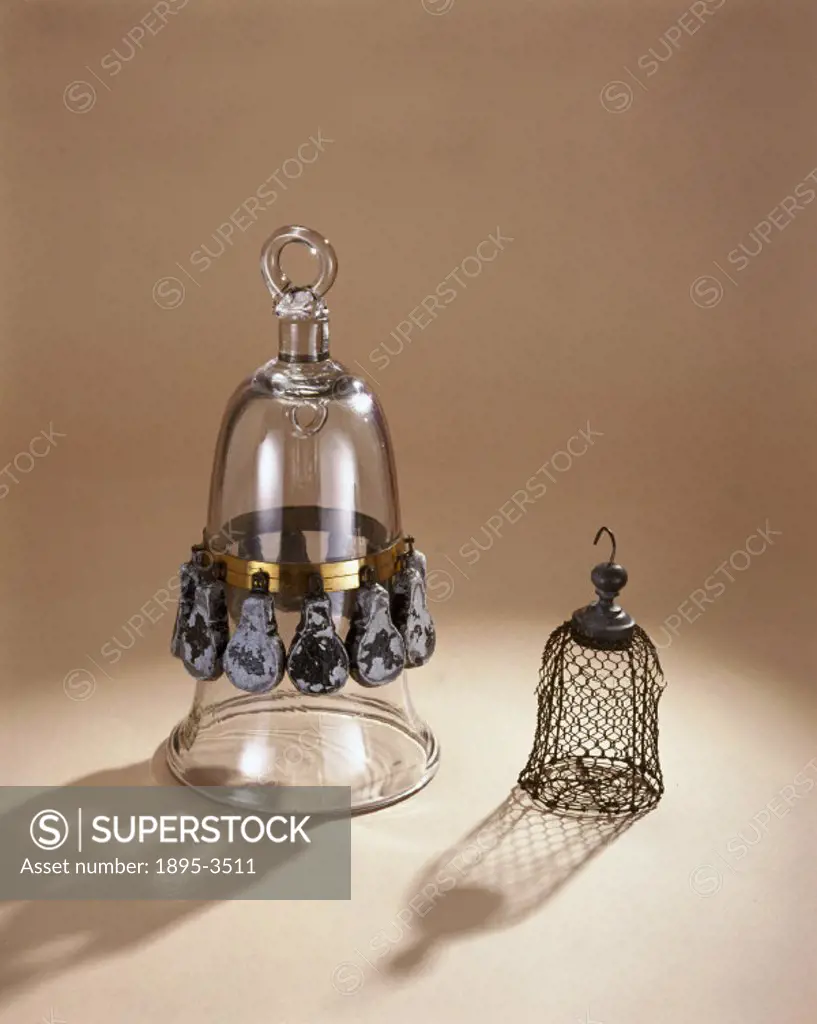 This is a standard diving bell model of the mid 18th century. It has twelve lead weights which kept it submerged. The wire cage was used to contain sm...