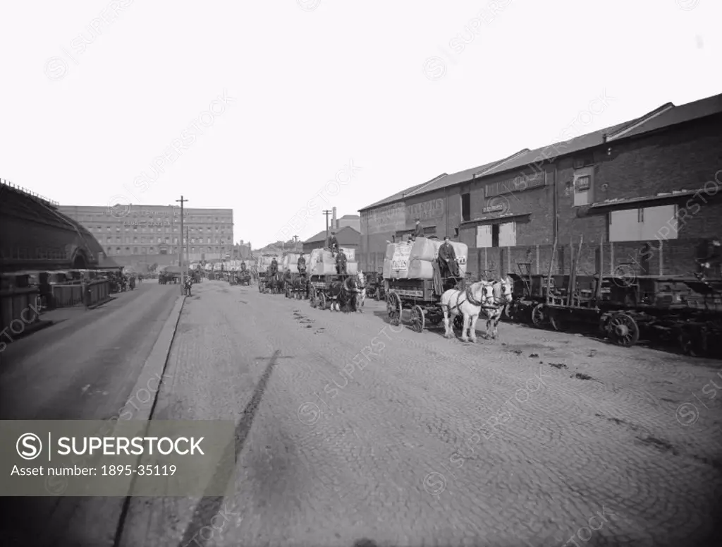 Horse drawn vehicles carrying Witney blankets at Paddington goods depot. Witney in Oxfordshire is famous for its blankets which have been made there s...