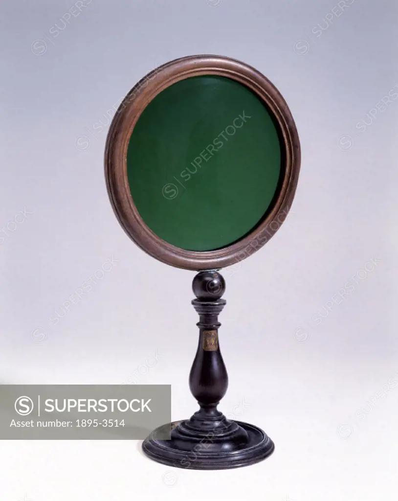 This green glass disc of 6 inches diameter was probably used for experiments on Isaac Newtons (1642-1727) theory of colour.