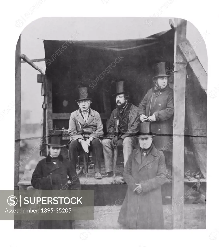 Isambard Kingdom Brunel, standing to the far right with his colleagues at the launch of his ship the SS Great Eastern, 1857. The seated man on the lef...