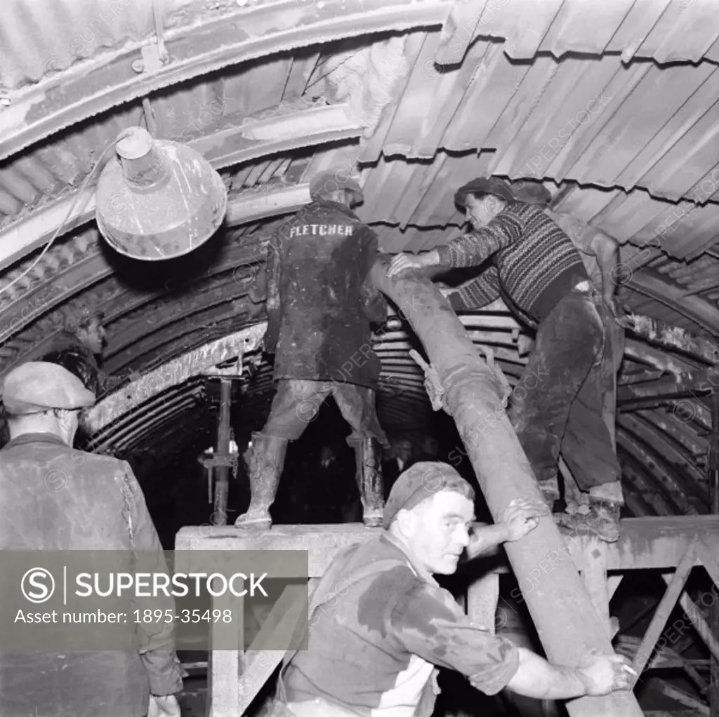 Workers fixing the lining to a tunnel on the Bevercotes Colliery line, Nottinghamshire, 13 October 1959. This branch line was 5 miles long and connect...